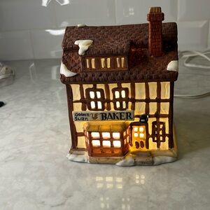 Dickens Village “Golden Swan Baker” Department 56.  Lights up
